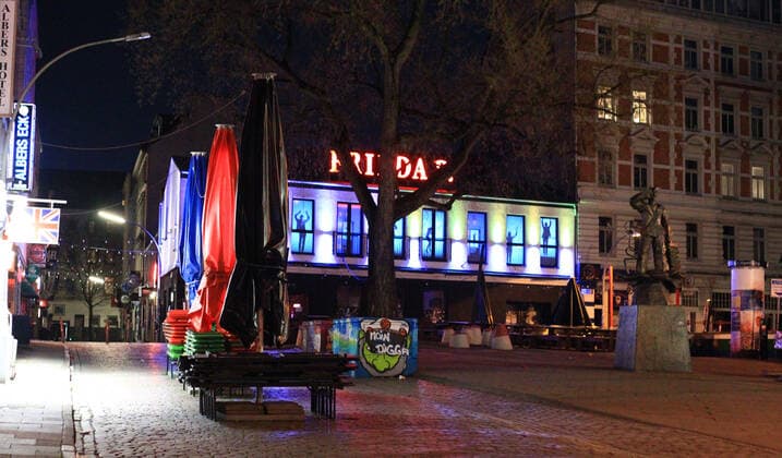 In the Kiez Club Frieda B on St Pauli, a beamer projects the outlines of dancing people onto screens behind the windows The popular dance club thus tries to convey a little normality in pandemic times St Pauli Hamburg
