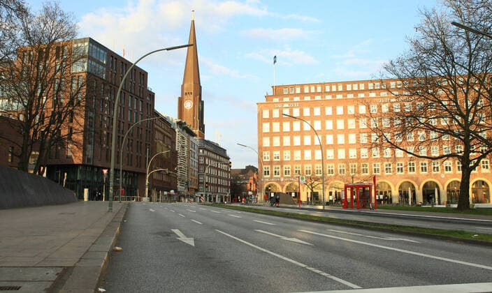 Car and deserted street Speersort in downtown Hamburg during the lockdown downtown Hamburg