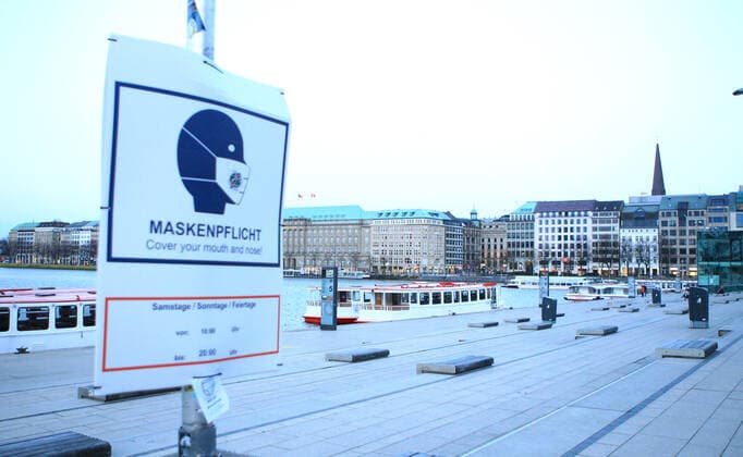 Deserted Alster jetty at Jungfernstieg in Hamburg city centre in the evening hours during the lockdown Hamburg city centre