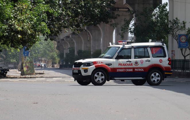 April 18, 2021, New Delhi, India: Delhi Police jeep patrols the street during the weekend lockdown imposed by the State government to curb the spike of coronavirus (Covid-19) cases. .Only essential services will be exempted from the lockdown, India reported 264,500 new Covid-19 infection cases, 1,501 deaths and 138,423 discharges in last 24 hours. New Delhi India - ZUMAs197 20210418_zaa_s197_070 Copyright: xNaveenxSharmax