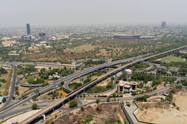 NOIDA, INDIA APRIL 18: An aerial view shows the city during a weekend lockdown imposed by the Uttar Pradesh to curb the spread of coronavirus disease (Covid-19), on April 17, 2021 in Noida, India. As the national capital gears up to live under weekend curfew from 10 pm on Friday till 5 am on Monday, the government on Friday announced directives for people who need to travel unavoidably within the city limits but do not have valid weekend curfew passes yet. (Photo by Sunil Ghosh Hindustan Times ) Roads Empty, Markets Shut As Delhi Enters Weekend Curfew Due To Covid-19 Pandemic
