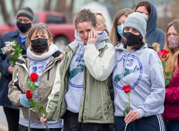 April 18, 2021, Bible Hill, NS, Canada: Family and friends of the victims of the April 2020 murder rampage in rural Nova Scotia, stand outside the RCMP detachment as they mark the one-year anniversary in Bible Hill, N.S. on Sunday, April 18, 2021. Bible Hill Canada  - ZUMAc35_ 20210418_zaf_c35_017 Copyright: xAndrewxVaughanx