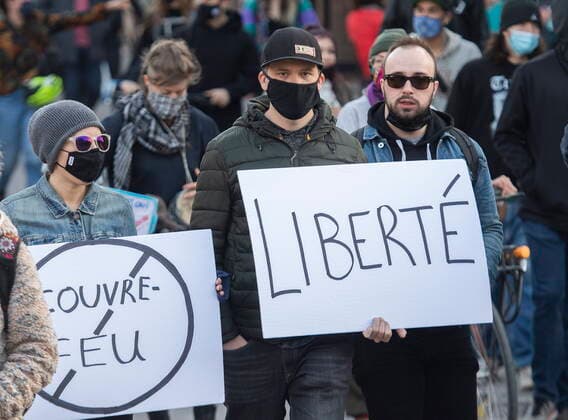 April 18, 2021, Montreal, PQ, Canada: People take part in a demonstration opposing the Quebec governmentÃ¢â‚¬â ¢s 8pm curfew in Montreal, Sunday, April 18, 2021, as the COVID-19 pandemic continues in Canada and around the world. Montreal Canada  - ZUMAc35_ 20210418_zaf_c35_034 Copyright: xGrahamxHughesx