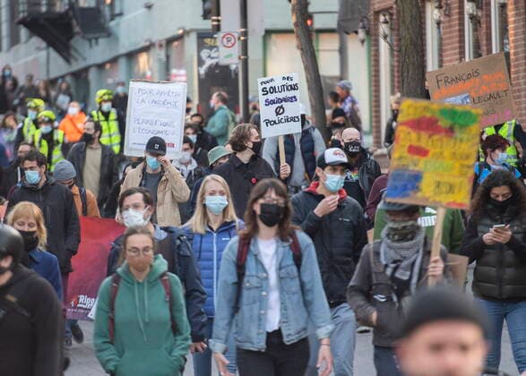 April 18, 2021, Montreal, PQ, Canada: People take part in a demonstration opposing the Quebec governmentÃ¢â‚¬â ¢s 8pm curfew in Montreal, Sunday, April 18, 2021, as the COVID-19 pandemic continues in Canada and around the world. Montreal Canada  - ZUMAc35_ 20210418_zaf_c35_052 Copyright: xGrahamxHughesx