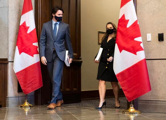 April 19, 2021, Ottawa, on, Canada: Prime Minister Justin Trudeau, left, arrives with Deputy Prime Minister and Minister of Finance Chrystia Freeland as she prepares to table the federal budget in the House of Commons in Ottawa, on Monday, April 19, 2021. Ottawa Canada  - ZUMAc35_ 20210419_zaf_c35_108 Copyright: xJustinxTangx