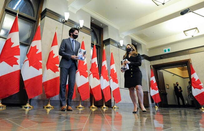 April 19, 2021, Ottawa, on, Canada: Prime Minister Justin Trudeau stands with Deputy Prime Minister and Minister of Finance Chrystia Freeland as she prepares to table the federal budget in the House of Commons in Ottawa, on Monday, April 19, 2021. Ottawa Canada  - ZUMAc35_ 20210419_zaf_c35_113 Copyright: xJustinxTangx