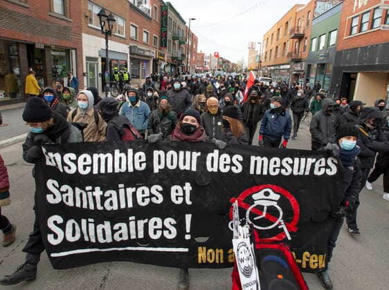 April 22, 2021, Montreal, PQ, Canada: People march in an anti-COVID-curfew protest Thursday, April 22, 2021 in Montreal. Montreal Canada  - ZUMAc35_ 20210422_zaf_c35_057 Copyright: xRyanxRemiorzx