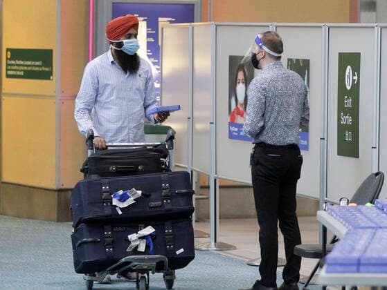 (210423) -- RICHMOND, April 23, 2021 -- A passenger from India is seen at the arrival hall at Vancouver International Airport in Richmond, British Columbia, Canada, April 23, 2021. Canada announced a 30-day ban on all flights from India and Pakistan effective Thursday as COVID-19 cases continue surging in the two countries. (Photo by Xinhua) CANADA-FLIGHT-RESTRICTION-COVID-19 LiangxSen 