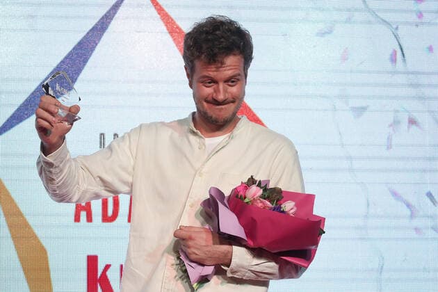 MOSCOW, RUSSIA - APRIL 23, 2021: Actor Tikhon Zhiznevsky receives an Avans award at a ceremony at the 43rd Moscow International Film Festival. Avans is an award presented annually by Kinoreporter magazine to young film actors. Valery Sharifulin TASS  TS0FDE27