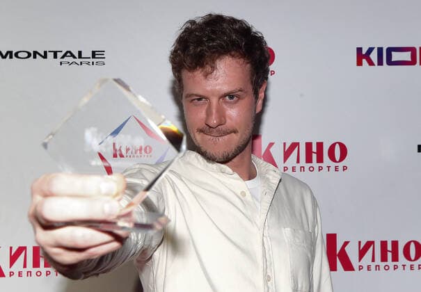 MOSCOW, RUSSIA - APRIL 23, 2021: Actor Tikhon Zhiznevsky receives an Avans award at a ceremony at the 43rd Moscow International Film Festival. Avans is an award presented annually by Kinoreporter magazine to young film actors. Valery Sharifulin TASS  TS0FDE2B