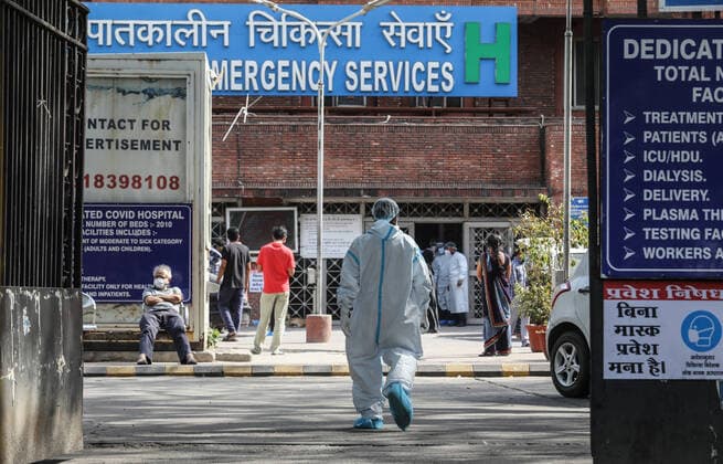 April 23, 2021, New Delhi, India: A health worker wearing a protective suit seen outside Lok Nayak Jai Prakash (LNJP) Hospital in Old Delhi..India is running out of oxygen during the second wave of Covid-19 pandemic. India has recorded 332,730 new Covid-19 cases in a single day and 2,263 deaths in the last one day. New Delhi India - ZUMAs197 20210423_zaa_s197_323 Copyright: xNaveenxSharmax
