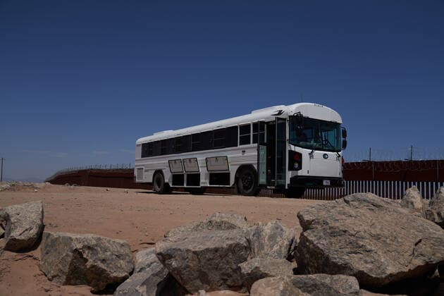 April 23, 2021, Yuma, Arizona, USA: A border patrol bus waits for asylum seeking migrants who surrender to United States Border Patrol at the US Border Wall with Mexico in Yuma, AZ. Yuma USA - ZUMAd211 20210423_zap_d211_006 Copyright: xAllisonxDinnerx