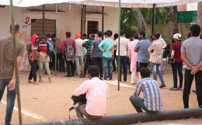 JAIPUR, INDIA - APRIl 23: People wait in a queue to get tested for Covid-19 infection, at SMS Hospital, on April 23, 2021 in Jaipur, India. (Photo by Himanshu Vyas Hindustan Times) Daily Life Amid Coronavirus Pandemic In India
