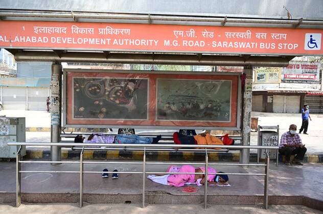 April 24, 2021, Prayagraj, Uttar Pradesh, India: Prayagraj: Commuters rest at a bus stop during a weekend lockdown imposed by the government as a preventive measure against the Covid-19 coronavirus, in Prayagraj on Saturday, April 24, 2021. Prayagraj India - ZUMAv115 20210424_zap_v115_008 Copyright: xPrabhatxKumarxVermax