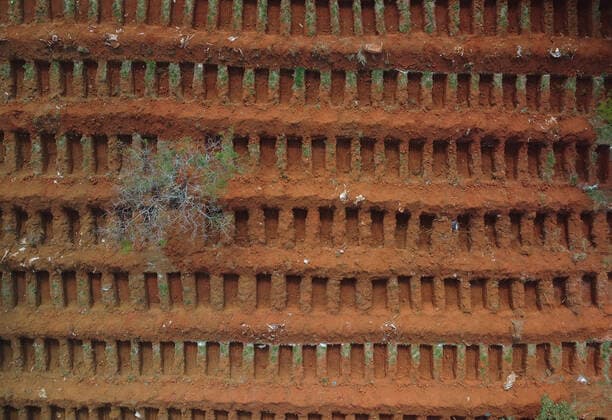 Brazil: View of the open graves at the Vila Formosa Cemetery (EDITORS NOTE: Image taken by a drone) Aerial images of the open graves at the Vila Formosa Cemetery in São Paulo. The country has recorded 2,866 deaths from Covid-19 in the past 24 hours and has totaled 386,623 deaths since the start of the pandemic. With that, the moving average of deaths in the last 7 days reached 2,514. Sao Paulo Brazil Copyright: RonaldoxSilva