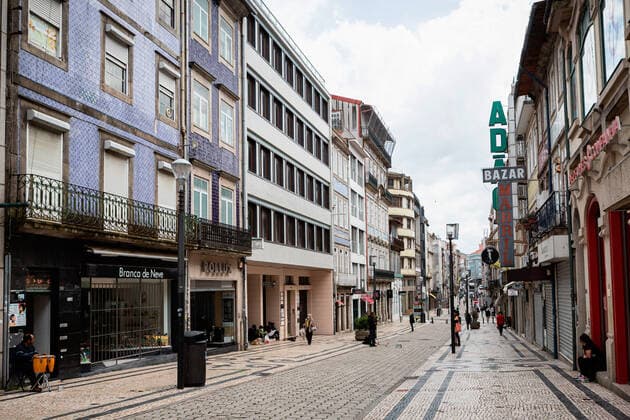 April 24, 2021, Porto, Portugal: People walk on a semi deserted Rua de Santa Catarina street..Portugal is at the 3rd stage of the deconfinement plan but stores, restaurants and coffee shops are still closed on the weekend during the afternoon. Porto Portugal - ZUMAs197 20210424_zaa_s197_213 Copyright: xTeresaxNunesx