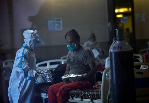 NEW DELHI, INDIA APRIL 25: A view inside the temporary Covid Care Centre set up at Shehnai Banquet Hall attached to LNJP Hospital, on April 25, 2021 in New Delhi, India. Oxygen support is also being provided here. (Photo by Sanjeev Verma Hindustan Times ) Daily Life Amid Coronavirus Pandemic In India