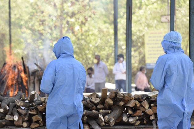 NOIDA, INDIA APRIL 25: A funeral pyre of a Covid-19 victim, at a crematorium, in Sector 94, on April 25, 2021 in Noida, India. (Photo by Sunil Ghosh Hindustan Times ) Covid Death Toll Continues To Rise In India