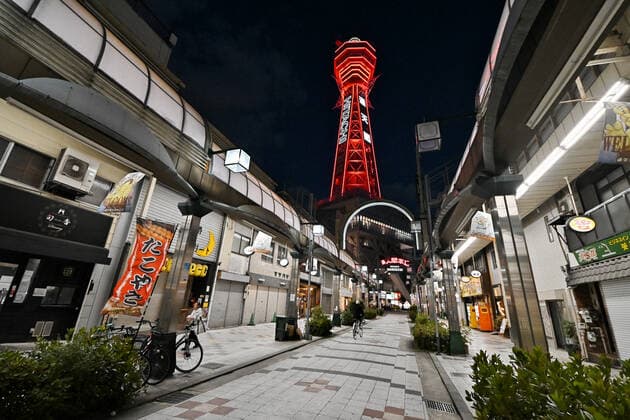 Tsutenkaku Tower is seen lit up in red as Osaka prefecture COVID-19 alarmed emergency in Osaka, Japan on April 25, 2021. Tokyo,Osaka, Kyoto and Hyogo prefectures entered a new state of emergency for COVID-19 on April 25 through May 11.  TKP2021042521 KEIZOxMORI