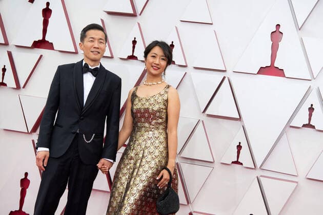 OscarÂ® nominee Lee Issac Chung and guest arrive on the red carpet of The 93rd OscarsÂ® at Union Station in Los Angeles, CA on Sunday, April 25, 2021. Los Angeles CA USA  Copyright: xMattxPetitx 34135075THA