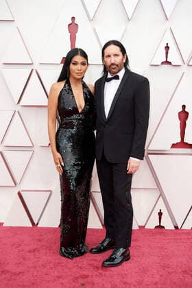 Mariqueen Maandig and OscarÂ® nominee Trent Reznor arrive on the red carpet of The 93rd OscarsÂ® at Union Station in Los Angeles, CA on Sunday, April 25, 2021. Los Angeles CA USA  Copyright: xMattxPetitx 34135122THA