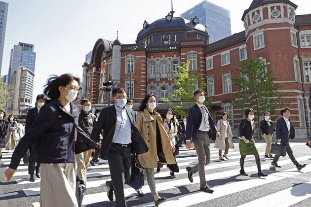 3rd COVID-19 emergency in Tokyo, Osaka area People wearing face masks walk near JR Tokyo Station in the Japanese capital on April 26, 2021. A third coronavirus state of emergency came into force in Tokyo and the western Japan prefectures of Osaka, Kyoto and Hyogo the previous day amid a resurgence in infections. 