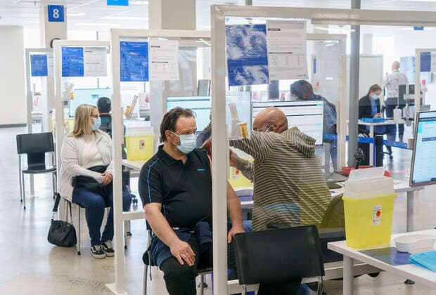 April 26, 2021, Montreal, PQ, Canada: Employees are vaccinated at a COVID-19 vaccination clinic at CAE headquarters in Montreal, on Monday, April 26, 2021. A provincial program to provide vaccinations at large businesses began today at the Montreal headquarters of the flight simulation technology manufacturer. Montreal Canada  - ZUMAc35_ 20210426_zaf_c35_059 Copyright: xPaulxChiassonx
