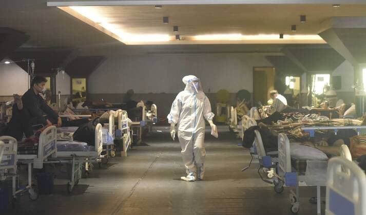 NEW DELHI, INDIA - APRIL 26: A view inside the temporary Covid Care Centre set up at Shehnai Banquet Hall attached to LNJP Hospital, on April 26, 2021 in New Delhi, India. India has registered 2,762 new deaths and 319,315 new infections recording more than 300,000 daily Covid-19 cases for the fifth day in a row, reaching a new record peak. (Photo by Sonu Mehta Hindustan Times) Temporary Covid-19 Care Centre In Delhi
