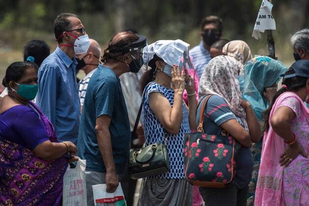 MUMBAI, INDIA - APRIL 26: People stand in queue in the hot weather for Covid-19 vaccination at NESCO Vaccination Centre, Goregaon, on April 26, 2021 in Mumbai, India. (Photo by Pratik Chorge Hindustan Times) 4th Phase Of Covid-19 Vaccination