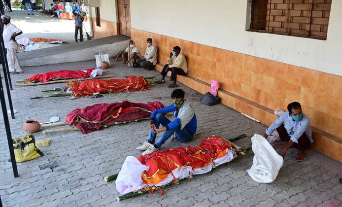 April 27, 2021, Prayagraj, Uttar Pradesh, India: Prayagraj: Family members waiting for cremation of patients who died of the Covid-19 coronavirus at a crematorium in Prayagraj. Prayagraj India - ZUMAv115 20210427_zap_v115_016 Copyright: xPrabhatxKumarxVermax