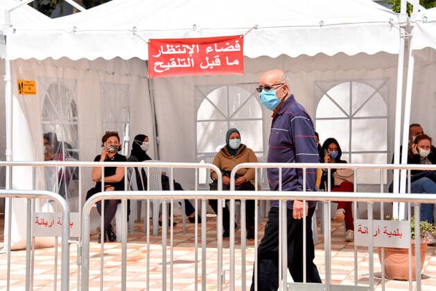 April 27, 2021, Tunis, Tunisia: People wait to receive a dose of the Pfizer-BioNTech COVID-19 vaccine at Ariana Youth Center as vaccination centers across the country experience an influx of registrations during Ramadan. Tunis Tunisia - ZUMAs197 20210427_zaa_s197_036 Copyright: xJdidixWassimx