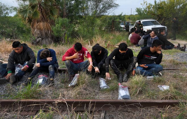 April 27, 2021, La Joya, Texas, USA: Asylum-seeking migrants are processed after crossing border from Mexico in La Joya TX on April 27, 2021. A surge has been overwhelming U.S. facilities at the southern borders. La Joya USA - ZUMAg208 20210427_zap_g208_005 Copyright: xCarolxGuzyx