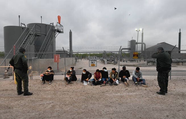 April 27, 2021, La Joya, Texas, USA: Asylum-seeking migrants are processed after crossing border from Mexico in La Joya TX on April 27, 2021. A surge has been overwhelming U.S. facilities at the southern borders. La Joya USA - ZUMAg208 20210427_zap_g208_008 Copyright: xCarolxGuzyx