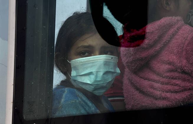 April 27, 2021, La Joya, Texas, USA: Asylum-seeking migrants are processed after crossing border from Mexico in La Joya TX on April 27, 2021. A surge has been overwhelming U.S. facilities at the southern borders. La Joya USA - ZUMAg208 20210427_zap_g208_013 Copyright: xCarolxGuzyx