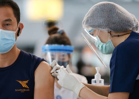 April 28, 2021, Bangkok, Thailand: A health worker inoculates an aviation-related personnel with the CoronaVac vaccine at Suvarnabhumi airport..The CoronaVac (Sinovac) vaccine is Chinese-made and developed by Sinovac Life Sciences..Ministry of Public Health and the Airport Operation Centre set up a new vaccination centre to remedy the Covid 19 emergency situation and efficiency of vaccination for aviation-related personnel. Bangkok Thailand - ZUMAs197 20210428_zaa_s197_021 Copyright: xChaiwatxSubprasomx
