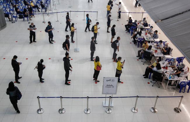 April 28, 2021, Bangkok, Thailand: Aviation-related personnel queue at a social distance for inoculations at Suvarnabhumi airport..The CoronaVac (Sinovac) vaccine is Chinese-made and developed by Sinovac Life Sciences..Ministry of Public Health and the Airport Operation Centre set up a new vaccination centre to remedy the Covid 19 emergency situation and efficiency of vaccination for aviation-related personnel. Bangkok Thailand - ZUMAs197 20210428_zaa_s197_033 Copyright: xChaiwatxSubprasomx