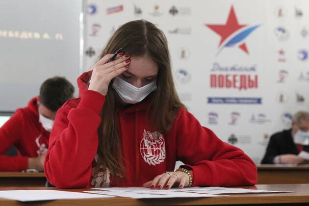 TVER REGION, RUSSIA â€“ APRIL 29, 2021: A girl wearing a face mask takes a history competence test on World War II, Victory Dictation, at the WWII Rzhev Memorial to the Soviet Soldier. Alexander Shcherbak TASS  TS0FE751