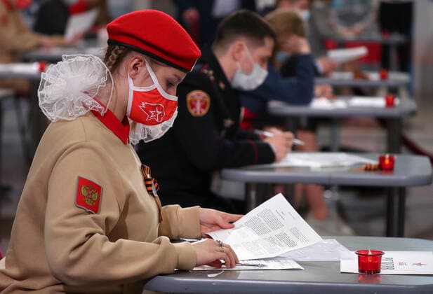 MOSCOW, RUSSIA â€“ APRIL 29, 2021: A member of the Yunarmiya youth military organization wearing a face mask takes a history competence test on World War II, Victory Dictation, at the Victory Museum on Poklonnaya Hill. Mikhail Tereshchenko TASS  TS0FE783