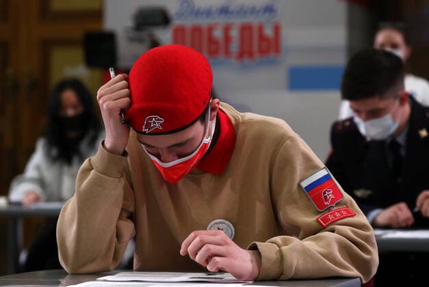 MOSCOW, RUSSIA â€“ APRIL 29, 2021: A member of the Yunarmiya youth military organization wearing a face mask takes a history competence test on World War II, Victory Dictation, at the Victory Museum on Poklonnaya Hill. Mikhail Tereshchenko TASS  TS0FE785