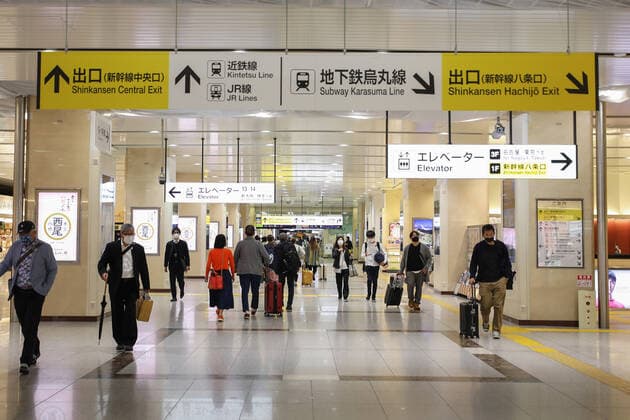 (210429) -- KYOTO, April 29, 2021 -- People wearing face masks walk at Kyoto Station during the start of Japan s Golden Week in Kyoto, Japan, April 29, 2021. The Japanese government imposed a state of emergency until May 11 in Tokyo, Osaka, Kyoto and Hyogo, which is aimed at curbing a surge in COVID-19 cases during the Golden Week holidays. ) JAPAN-GOLDEN WEEK-COVID-19-STATE OF EMERGENCY DuxXiaoyi 