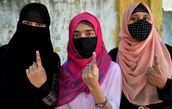 India: Eight phase of West Bengal state elections Voters stand in a queue at a polling station during the eight phase of West Bengal state elections in Kolkata, India. India Copyright: SanjayxPurkait