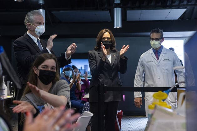 Vice President Kamala Harris (C), alongside pulmonologist Dr. Jason Marx (R) and Democratic Senator from Maryland Chris Van Hollen (L), visits the M&T Bank Stadium Mass Vaccination SITE on her 100th day in office in Baltimore, Maryland, on Thursday, April 29, 2021.  BAL20210429112 JIMxLOxSCALZO