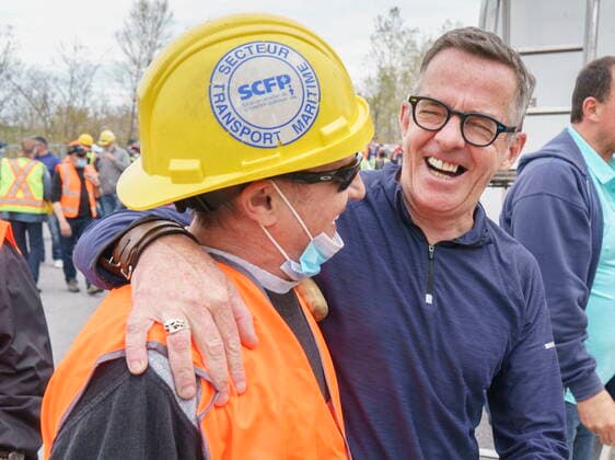 April 29, 2021, Montreal, PQ, Canada: Michel Murray, spokesman with the Canadian Union of Public Employees, shares a laugh with a striking Port of Montreal dockworker during a rally in Montreal on Thursday, April 29, 2021. Montreal Canada  - ZUMAc35_ 20210429_zaf_c35_064 Copyright: xPaulxChiassonx