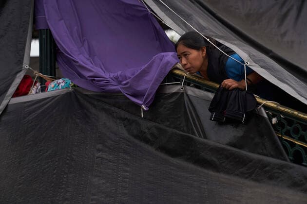 April 29, 2021, Reynosa, Mexico: A women looks out from her tent. Asylum seeking migrants from Central America are living on the street in Reynosa, Mexico while they wait for President Biden to open the US border for them to try to cross. Reynosa Mexico - ZUMAd211 20210429_zap_d211_002 Copyright: xAllisonxDinnerx