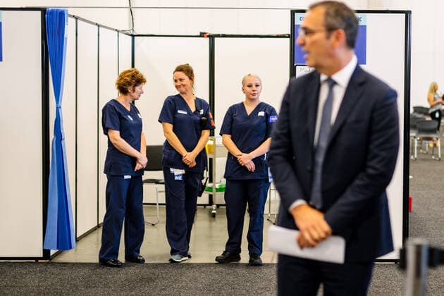 STEVEN MARSHALL COVID19 PRESSER, Three nurses stand behind South Australian Premier Steven Marshall during a press conference at the Adelaide Showgrounds Vaccination Centre in Adelaide, Friday, April 30, 2021. ( NO ARCHIVING, EDITORIAL USE ONLY, NO USE IN BOOKS WITHOUT CONSENT ADELAIDE SA AUSTRALIA  Copyright: xMORGANxSETTEx 20210430001538618524