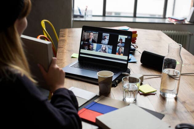 Cropped hand of businesswoman explaining about product to customers over video conference in office Sweden, Stockholm, model released, property released Copyright: xMaskotx , MA85846