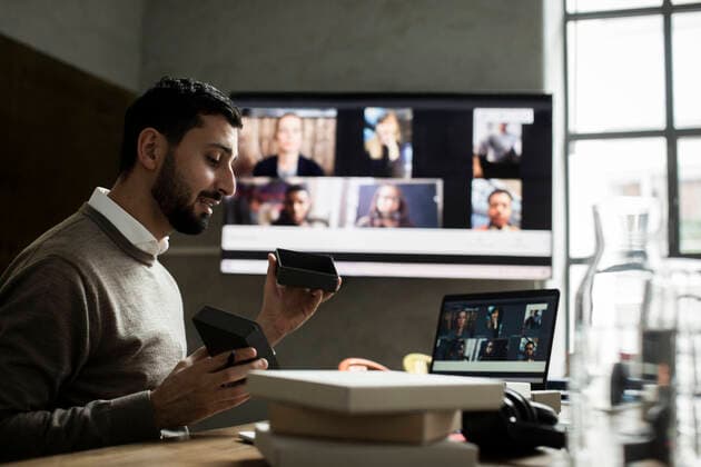 Male entrepreneur explaining about product to customers through video conference on laptop in office Sweden, Stockholm, model released, property released Copyright: xMaskotx , MA85849