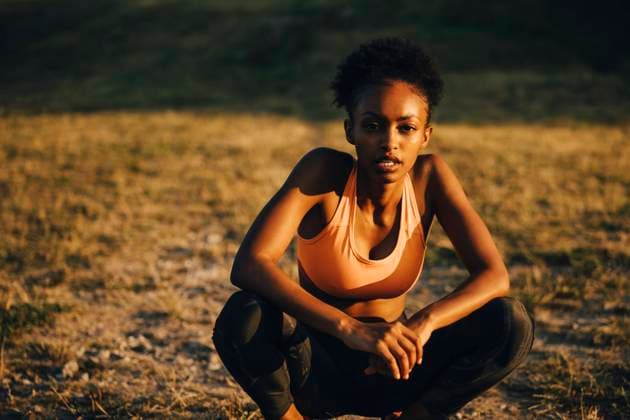 Portrait of female athlete on land during sunset Sweden, Stockholm, model released Copyright: xMaskotx , MA86097