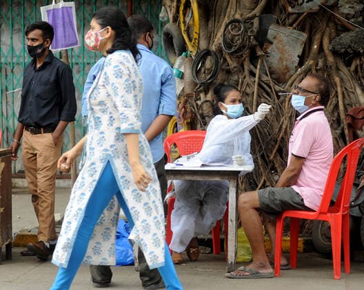 MUMBAI, INDIA ? APRIL 29: A BMC healthcare worker collects swab samples of the people at Vegetable Market, in Vile Parle (East),, on April 29, 2021 in Mumbai, India. (Photo by Vijay Bate Hindustan Times ) Medical Team Conducts COVID-19 Coronavirus Test