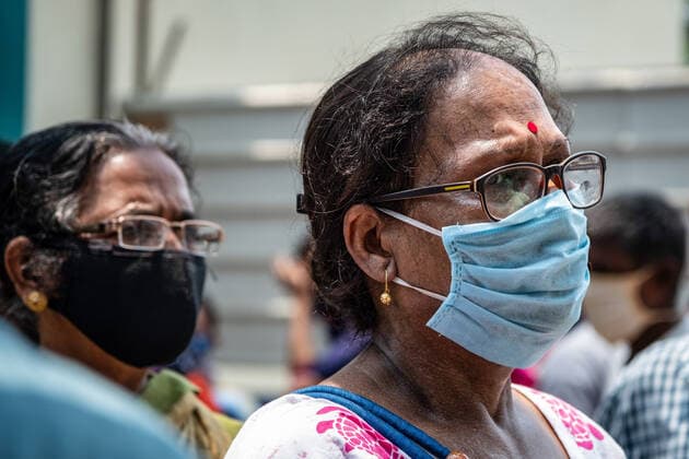 April 30, 2021, Barasat, India: A woman wearing a mask waits in a queue to be vaccinated at the Barasat state General hospital amid the deadly second wave of COVID-19..India is reportedly running out of Covid-19 vaccines just as a virulent second wave continues to devastate the country, threatening the governmentis plans to ramp up the vaccination programme by the weekend in an effort to curb the spread of the virus. Barasat India - ZUMAs197 20210430_zaa_s197_036 Copyright: xDipayanxBosex